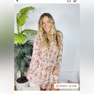 Cream with flowers all over flowy dress. Cinches at waist but not tight.